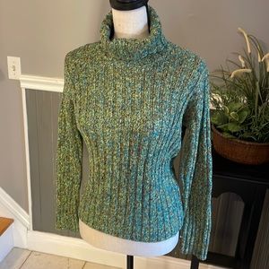 Green turtleneck cable knit sweater